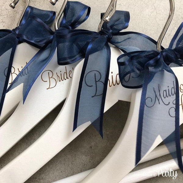 Set of 2 adult size engraved white wooden hangers – The Party, Dubai