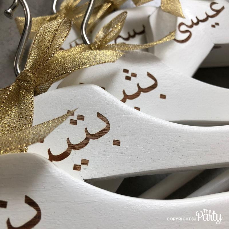 Set of 2 adult size engraved white wooden hangers – The Party, Dubai